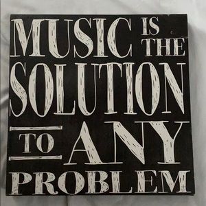 “Music is the solution to any problem” sign